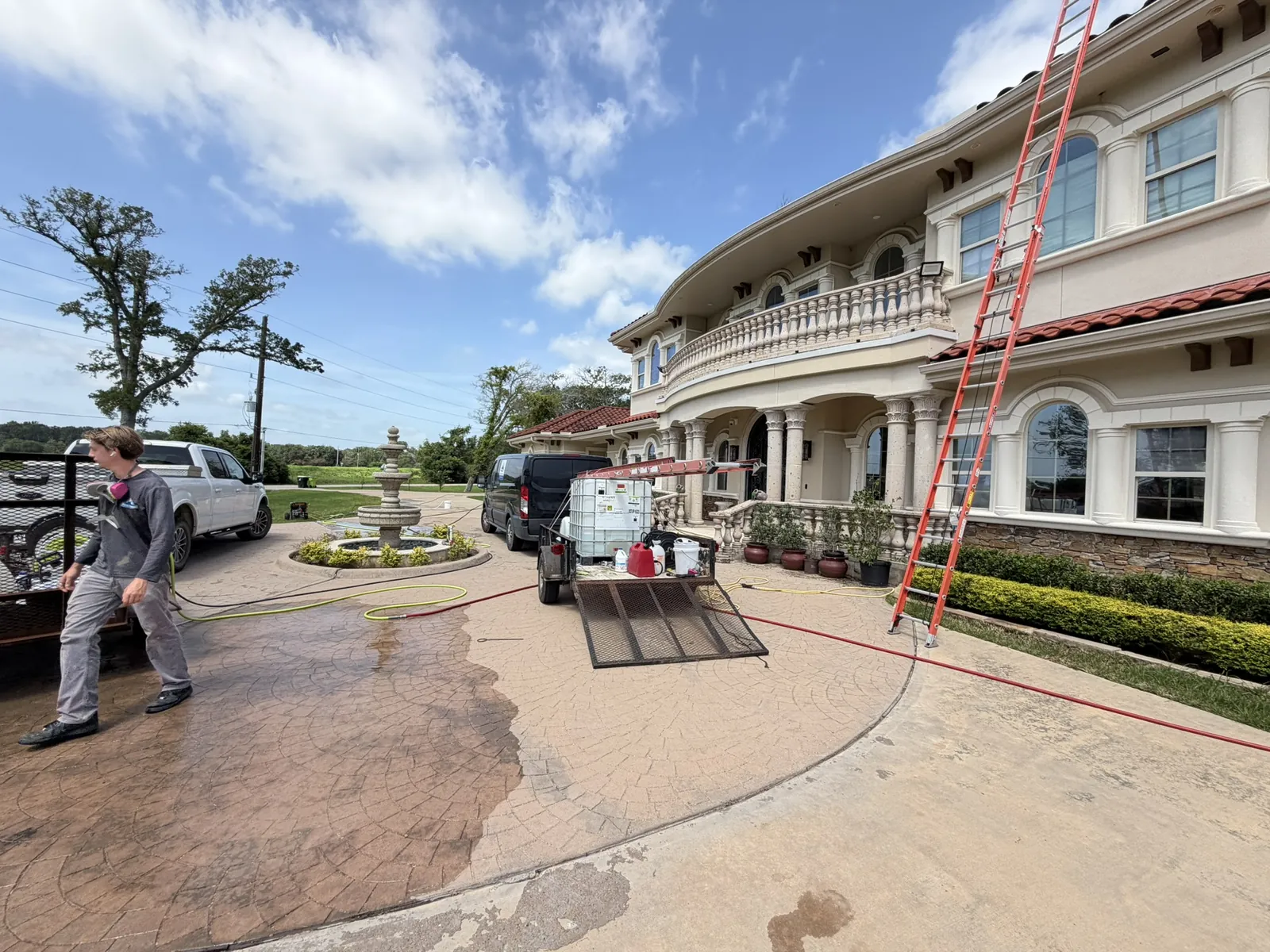 Peak Clean pressure washing equipment set up at a large Houston-area home