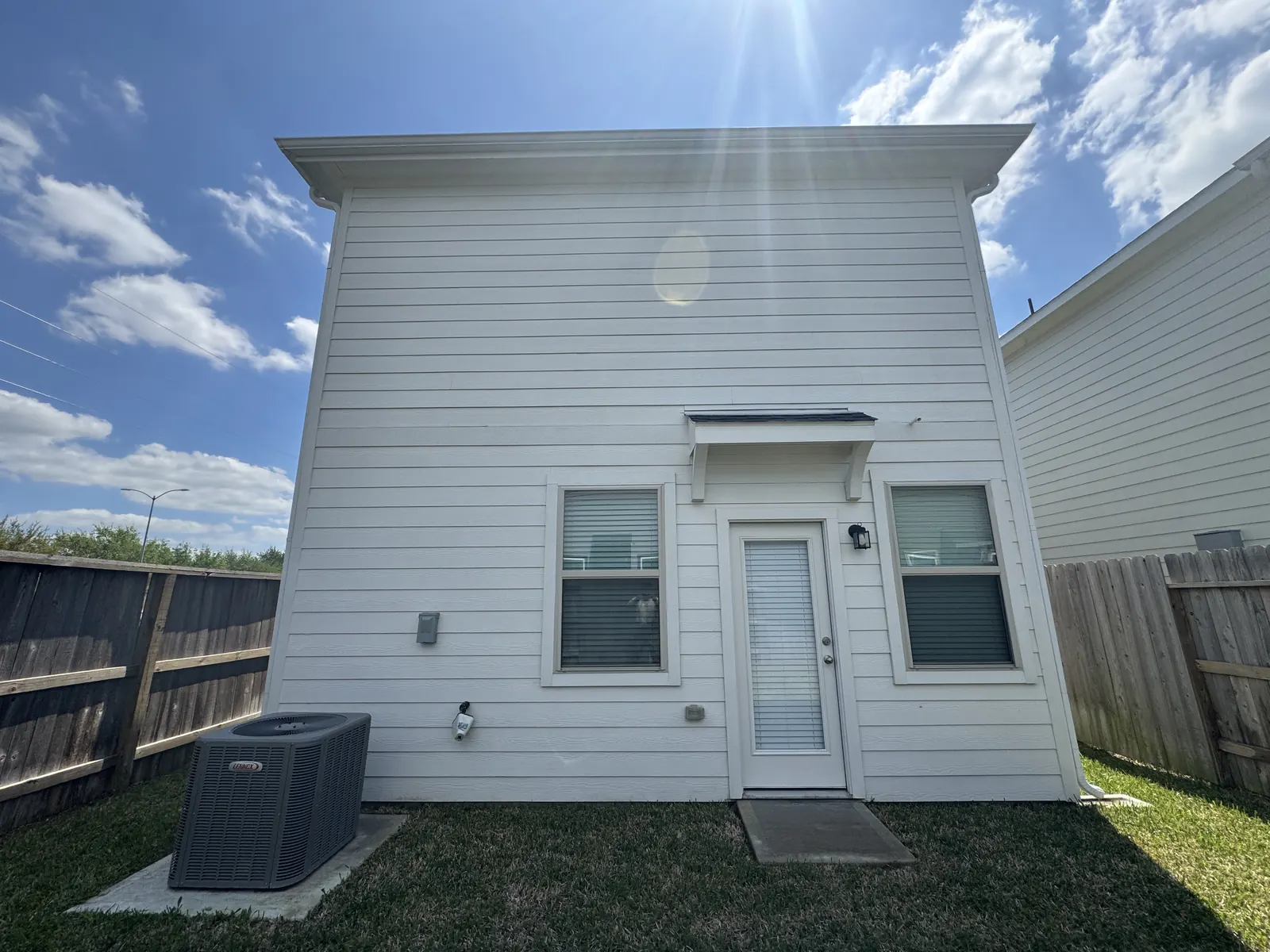 Clean white siding after soft washing